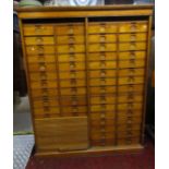 An early 20th century oak floorstanding filing cabinet fitted with a segmented tower arrangement