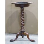 A 19th century rosewood plant/jardinière stand, the circular petal shaped top raised on a spiral