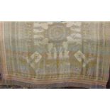 Textile panel/ bed cover depicting Egyptian figures and symbols in muted shades with lustrous
