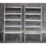A pair of vintage painted pine folding trestles 83 cm wide x 185 cm in height (closed)