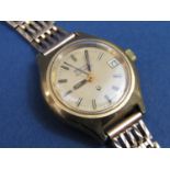 Vintage ladies Bulova Accutron gold plated wristwatch, the champagne dial with baton markers and