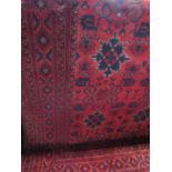 A good quality Persian carpet with geometric red and blue pattern, 310 x 210cm
