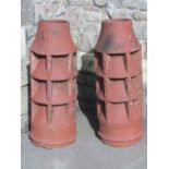 A pair of reclaimed terracotta vented cylindrical chimney pots, 78 cm high (AF) (until recently used