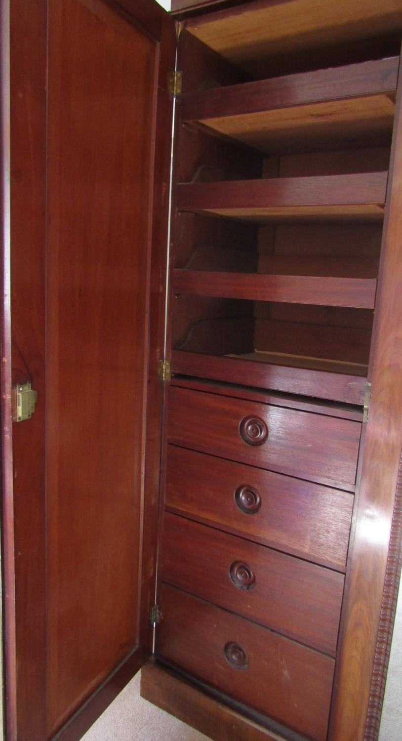 A good quality Victorian mahogany triple wardrobe, the central mirror panelled door flanked by two - Image 6 of 6