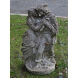 A weathered cast composition stone garden figure group in the form of a romantic couple, 70 cm high,