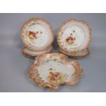 A collection of early 20th century Limoges dessert wares with shaped and pierced borders and printed