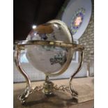 Gem set terrestrial globe upon a brass stand, 47cm high