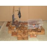 A collection of vintage carpentry tools mainly a variety of planes, square gauges, etc