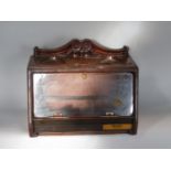 A good vintage table top cigar cabinet, with hinged glass front and various carvings and