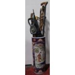 A Chinese Imari porcelain stick stand fitted with various walking canes to include tribal