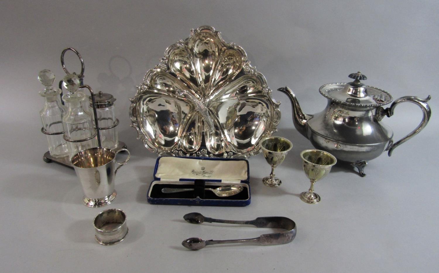 A small collection of silver plated items comprising a four piece bottle cruet, a squat baluster