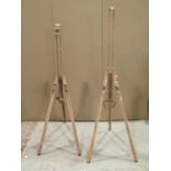 Two small beechwood portable folding artists easels, one labelled The Portland, the other stamped