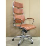 A contemporary modernist high back swivel and adjustable office desk chair with stitched brown