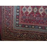 Afghan Bokhara type rug with geometric medallion decoration upon a red ground, 200 x 110cm