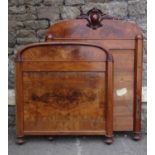 A pair of 19th century mahogany single bedsteads, the moulded arched head and footboards with well