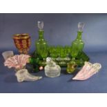 Green glass decanter drinks set comprising two lidded decanters and eight small glasses, all