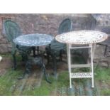 A cast aluminium garden terrace table of circular form with decorative pierced top and weathered