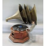 A vintage wooden octagonal gramophone/78 player with four similar brass horns (5)