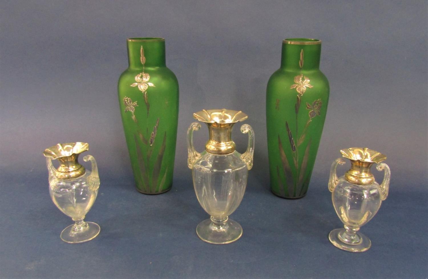 Glass and silver collared garniture of baluster vases with twin fluted handles, the largest 16.5cm