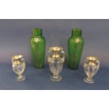 Glass and silver collared garniture of baluster vases with twin fluted handles, the largest 16.5cm