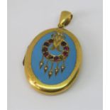 Victorian yellow metal locket ornately decorated with garnets, seed pearls and turquoise enamel, 5.4