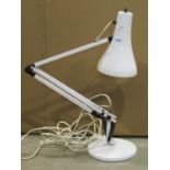 Contemporary anglepoise table lamp in a cream colourway with domed disc shaped platform base