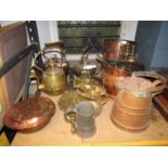 A collection of antique and later copper and brassware to include various kettles, copper warming