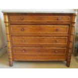 A matched pair of 19th century continental pine and beechwood chests of four drawers, with faux