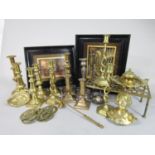 A large collection of various brass wares, mainly candlesticks and others, together with a pair of