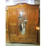 An Edwardian mahogany bedroom pair and similar matching dressing chest with raised oval swing mirror