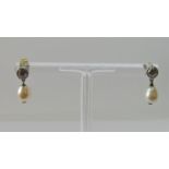 Pair of early 20th century diamond and pearl drop earrings, millegrain set in unmarked white