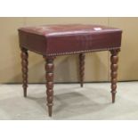 A 19th century rosewood stool of rectangular form with buttoned maroon faux leather upholstered