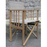 Ten oak framed folding directors type chairs, with canvas seats and backs