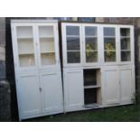 A narrow painted pine framed three sectional housekeepers cupboard enclosed by twelve rectangular
