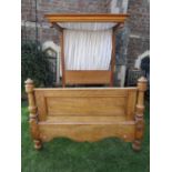 A Victorian satin birch half tester bedstead with moulded canopy and panelled foot board flanked