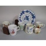 A small collection of children's mugs including a Royal Doulton blue and white example - Gathering