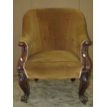 A Victorian spoon back drawing room chair with mustard coloured upholstered seat and button back