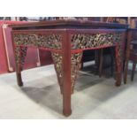 A Chinese stained hardwood centre table (104 cm square) raised on square cut and moulded supports