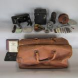 A box of interesting items to include various vintage fishing reels, cameras, pen knives to