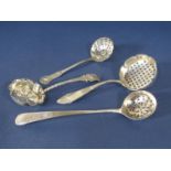 Three silver sifter spoons, each with fancy handles and pierced bowls, 3 oz approx (4)