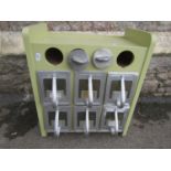 A small light green painted retro style kitchen cabinet enclosing six tin drawers with loop