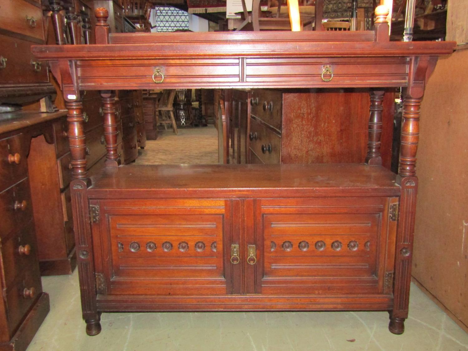 A good quality late Victorian walnut buffet by Gillow & Co Lancaster, with shallow mould rail back