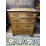 A small Georgian mahogany chest of four long graduated drawers, with brass swan neck handles, raised