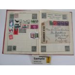 Two stamp albums containing a quantity of British and worldwide stamps dating from the early 20th