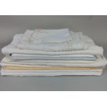 10 starched damask table cloths, mostly white with 2 further cloths with crochet inserts (one box)