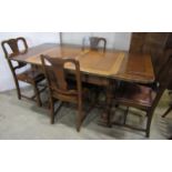 A 1930s oak dining room suite comprising a draw leaf table, set of four chairs with drop-in hide