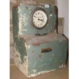 A vintage auto clock systems clocking in clock with circular dial