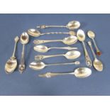 A collection of good novelty and souvenir spoons, many with thistle decoration and other pierced and