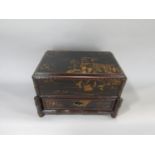 A Japanese lacquered Mahjong set, the hinged lid and frieze drawer enclosing various counters and