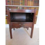 A mahogany tray top commode in the Georgian manner, with open centre over a single frieze drawer,